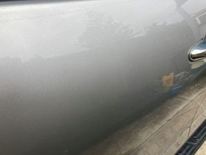 “Close-up of a car's paintwork after scratch removal and polishing on the Gold Coast.”