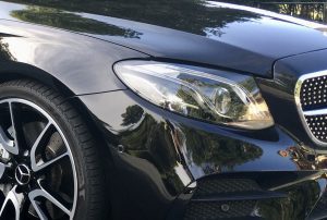  "Close-up of a car’s vibrant paint after polishing."